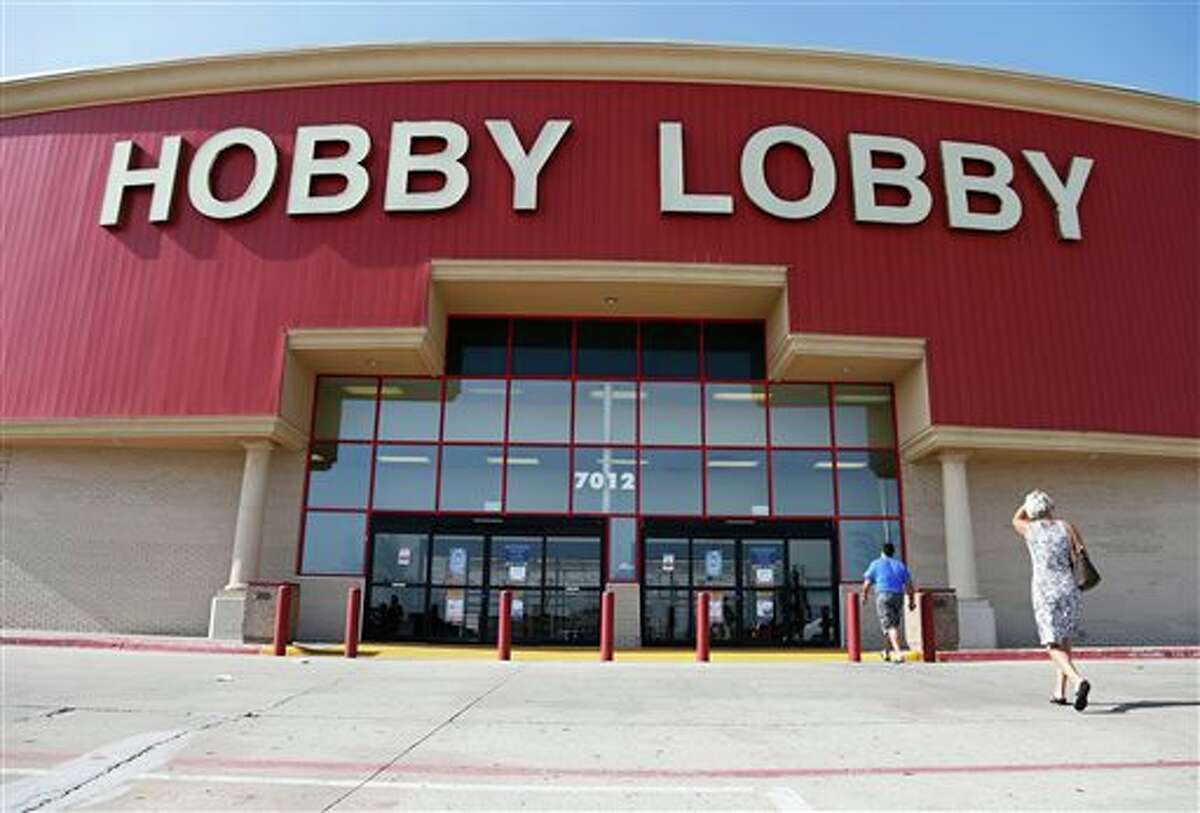 Customers walk to a Hobby Lobby store in Oklahoma City, Monday, June 30, 2014. The Supreme Court ruled Monday that employers can hold religious objections that allow them to opt out of the new health law requirement that they cover contraceptives for women. The Hobby Lobby chain of arts-and-crafts stores is by far the largest employer of any company that has gone to court to fight the birth control provision. (AP Photo/Sue Ogrocki)