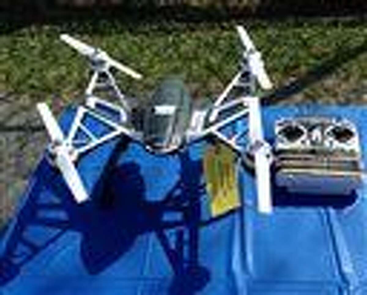 This photo shows a Yuneec Typhoon drone and controller Monday, Aug. 24, 2015, in Jessup, Md. Maryland State Police and prison officials say two men planned to use the drone to smuggle drugs, tobacco and pornography videos into the maximum-security Western Correctional Institution near Cumberland, Md. Police arrested the men with the drone, the materials and a handgun in a vehicle Saturday, Aug. 22, 2015. (AP Photo/David Dishneau)