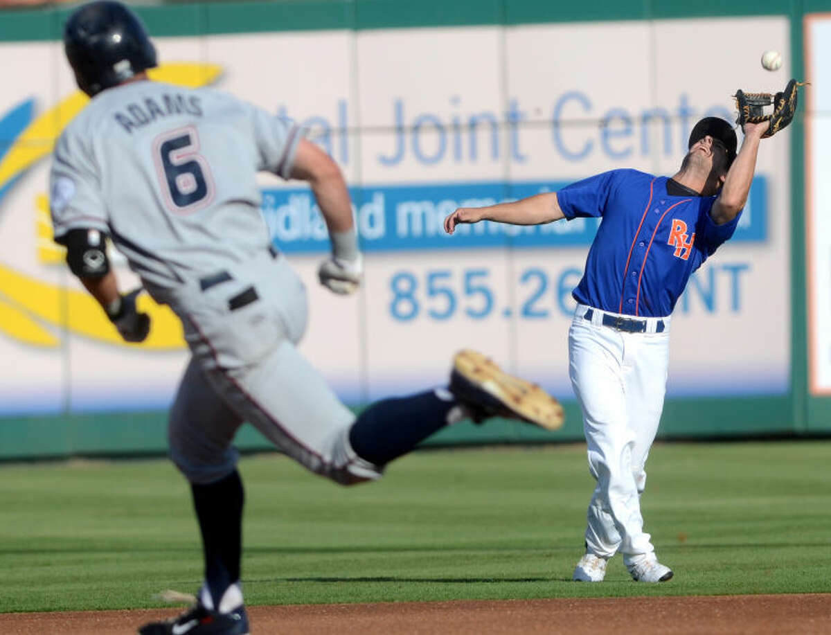 Rockhounds Conner Crumbliss catches a fly ball from Northwest Arkansas' Lane Adams (running in foreground) last Friday at Security Bank Ballpark. Midland faced Northwest Arkansas once again Wednesday, and it resulted in another loss. James Durbin/Reporter-Telegram