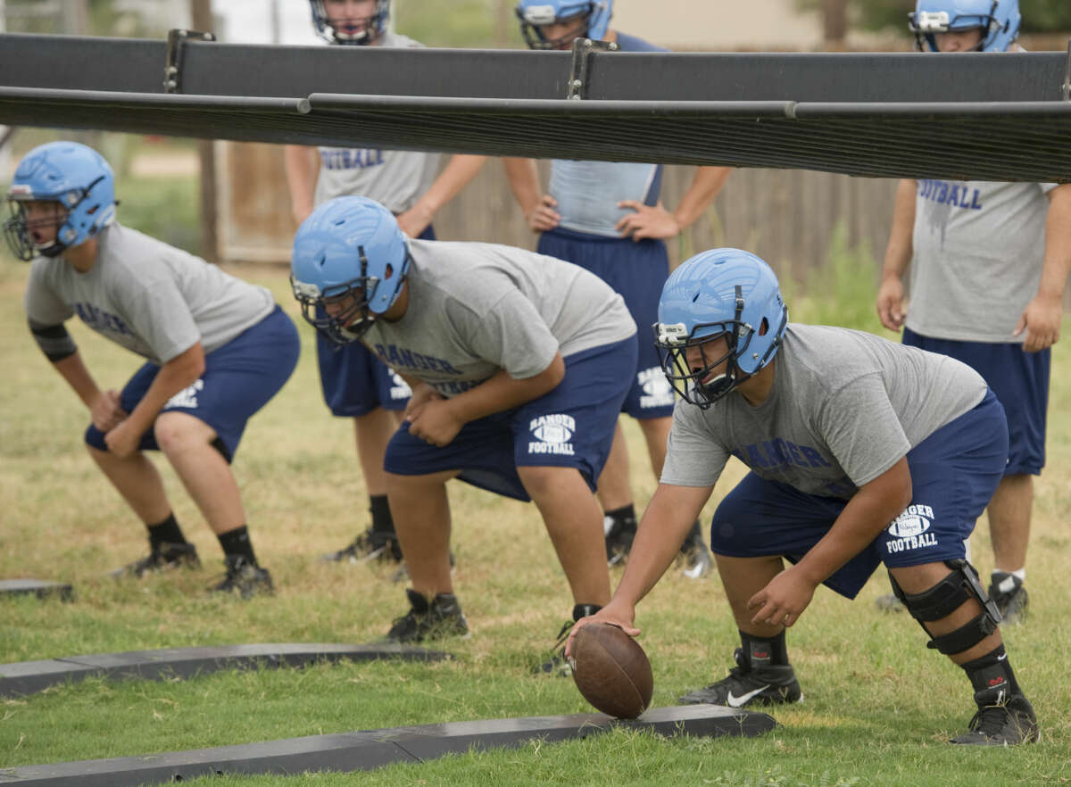 Greenwood center Jesus Rodriguez and other offensive lineman run drills Monday 8-3-15, during the first day of practice for 2015-2016 season. Tim Fischer\Reporter-Telegram
