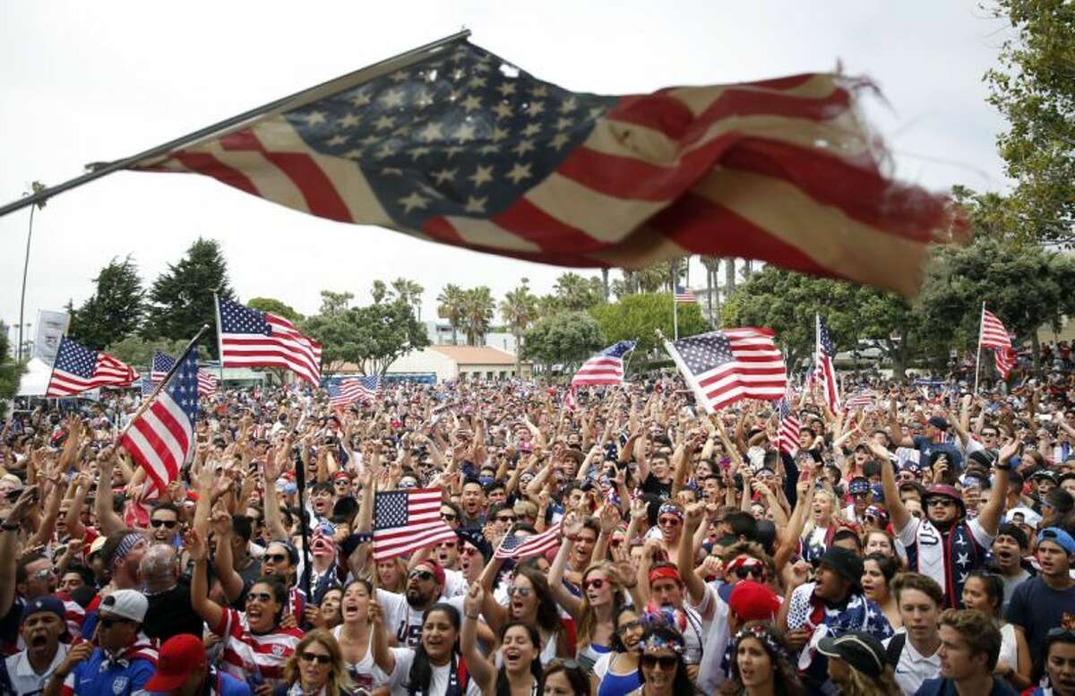 United States fans cheer while watching the World Cup soccer match between the U.S. and Belgium at a viewing party on Tuesday, July 1, 2014, in Redondo Beach, Calif. Belgium won 2-1 in extra time. (AP Photo/Jae C. Hong)