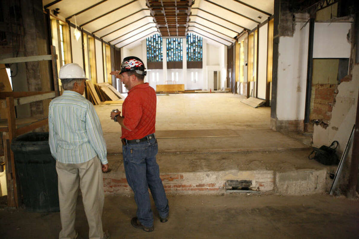 First Presbyterian Church member Pam Hunter, left, talks with Jeremy Olive, director of operations at First Presbyterian, while touring an area under construction Wendesday. James Durbin/Reporter-Telegram