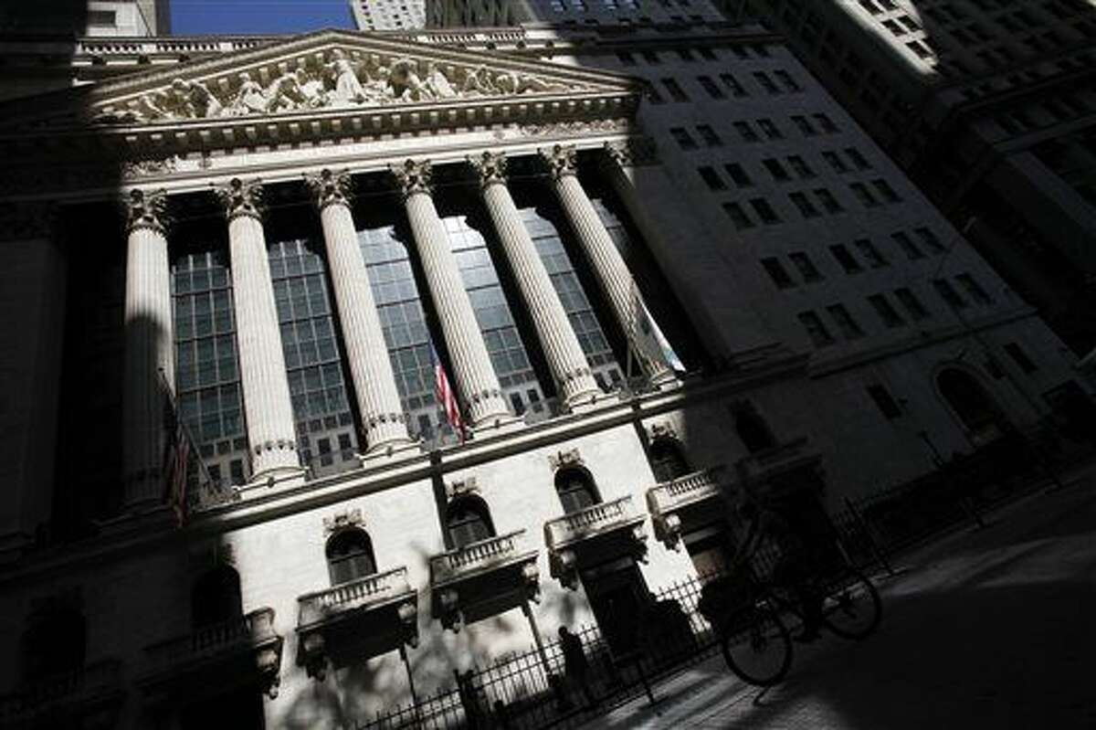 FILE - This July 15, 2013 file photo shows the New York Stock Exchange in New York. Global stock markets fell sharply Friday, Sept. 4, 2015, ahead of the release of monthly U.S. jobs figures that could well determine whether the Federal Reserve will raise interest rates later this month, a prospect that's unnerving investors at a time when markets have been so volatile. (AP Photo/Mark Lennihan, File)