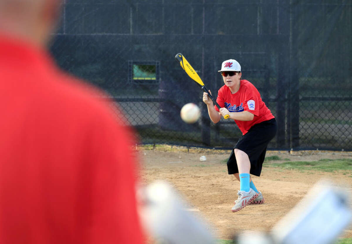 Bryce Lewis, a member of Midland's Little League Intermediate Team All-Stars, practices bunting on Monday at Mid Cities. James Durbin/Reporter-Telegram