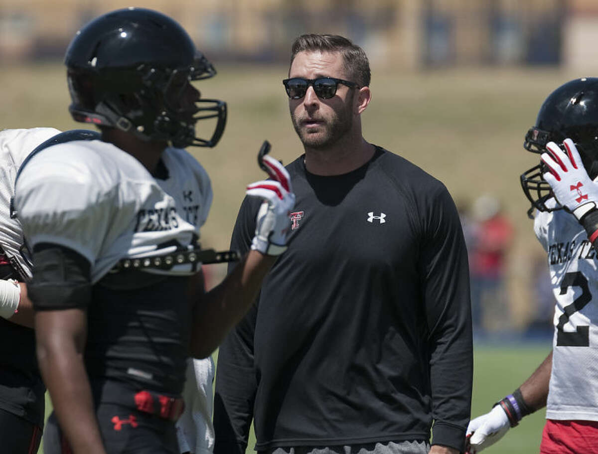 Tech coach Kliff Kingsbury talks with his players after a series back on March 29 at the Texas Tech scrimmage at Grande Communications Stadium. Tim Fischer\Reporter-Telegram