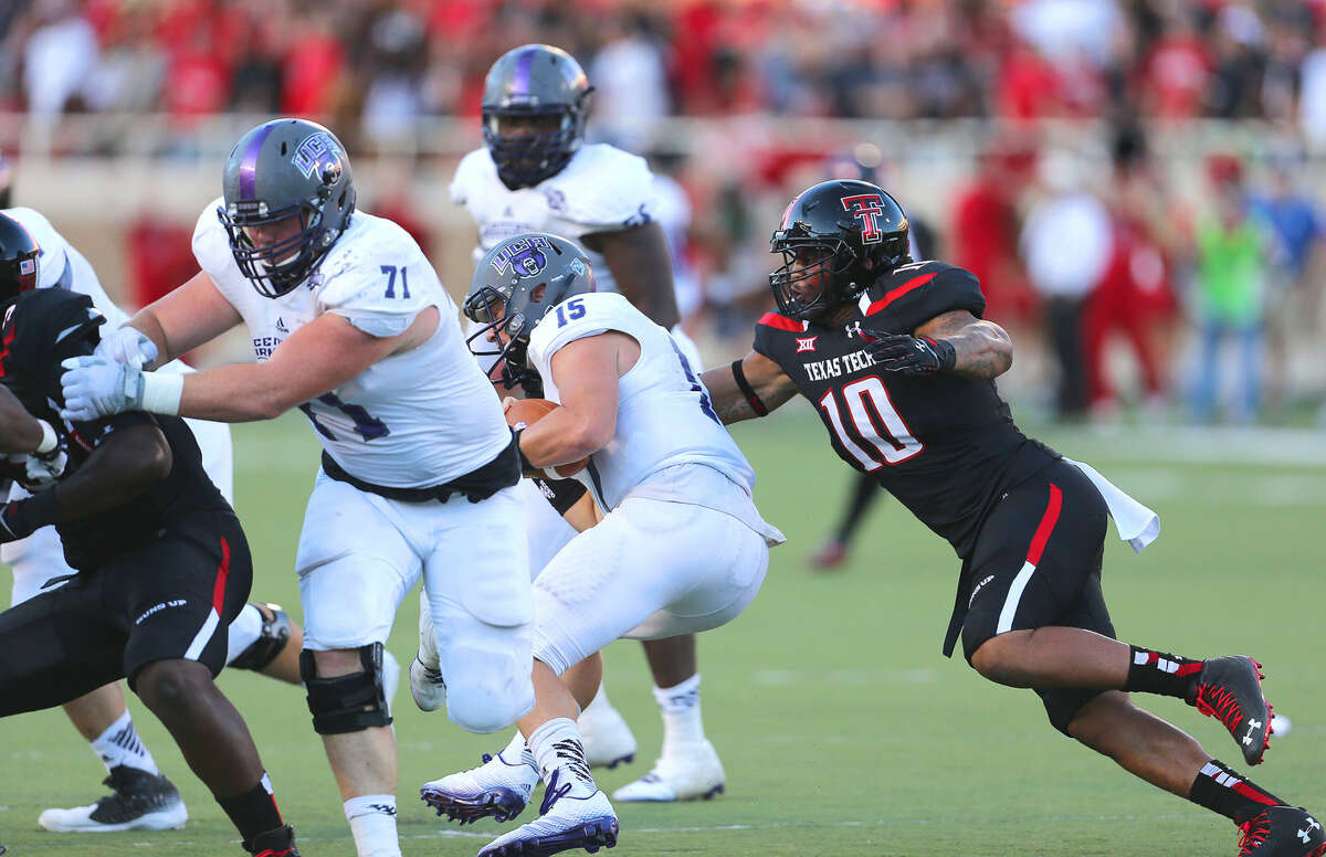 Texas Tech linebacker Pete Robertson (10) grabs hold of Central Arkansas quarterback Taylor Reed and sacks him for a loss in the Red Raiders' home opener last Saturday night at Jones AT&T Stadium.