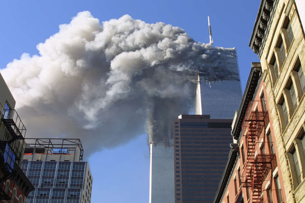 FILE - In this Sept. 11, 2001 file photo, the twin towers of the World Trade Center burn after hijacked planes crashed into them in New York. A person familiar with developments said Sunday, May 1, 2011 that Osama bin Laden is dead and the U.S. has the body. (AP Photo/Diane Bondareff, File)