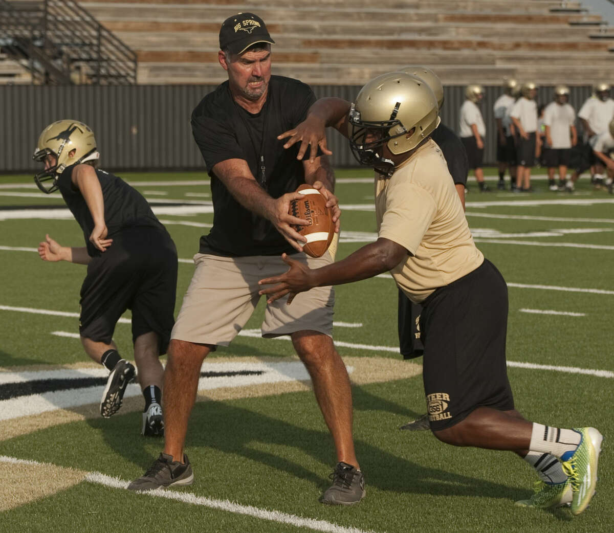 Big Spring coach Phillip Ritchey works with his players during practice. Tim Fischer\Reporter-Telegram