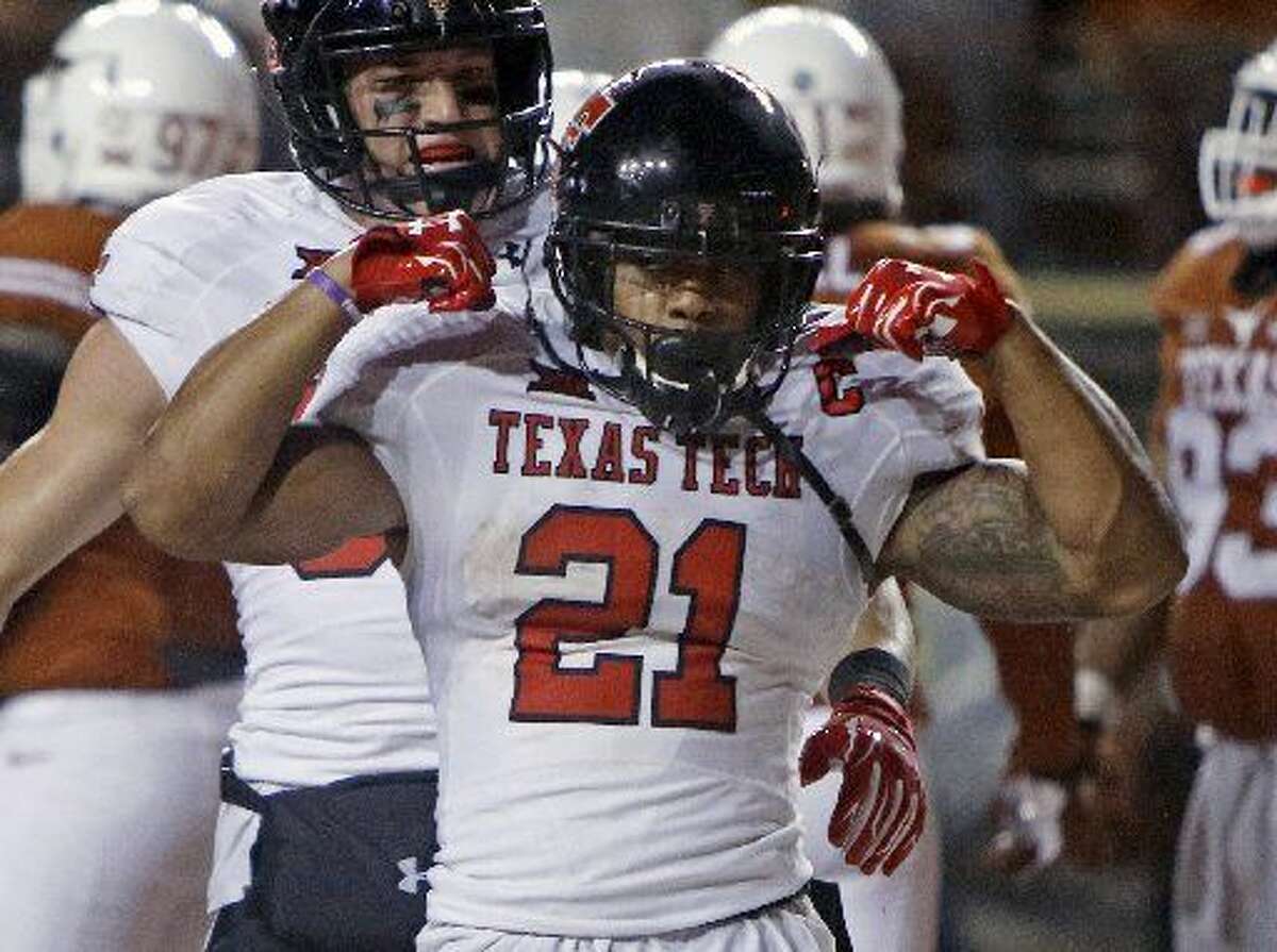 Texas Tech's DeAndre Washington (21) celebrates his touchdown during the second half of an NCAA college football game against Texas, Thursday, Nov. 26, 2015, in Austin Texas Tech won 48-45. (AP Photo/Michael Thomas)