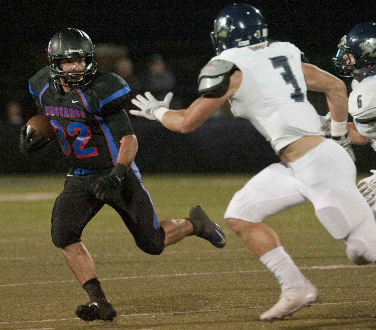 Midland Christian's Justin Fender tries to get around Argyle Liberty's Hunter Griffith Friday at Mustang Field. Tim Fischer\Reporter-Telegram