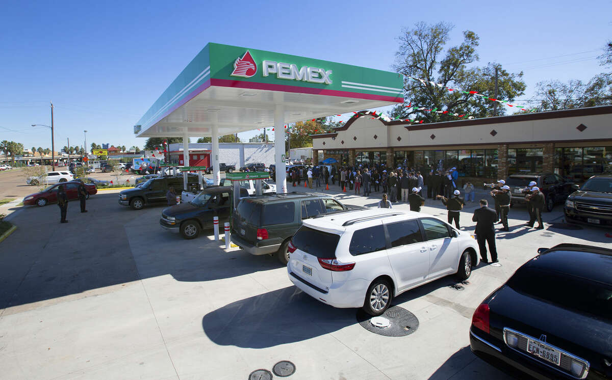 Guests attend the grand opening of PEMEX in the 7900 block of Park Place Blvd, Thursday, Dec. 3, 2015, in Houston. The national energy company of Mexico, Pemex, is launching its brand in the U.S. with retail gasoline stations, starting in Houston. (Cody Duty / Houston Chronicle)
