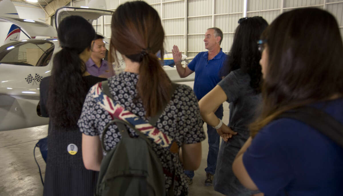 Randy Baker, XCOR COO, speaks to Chinese journalists as they get a tour Friday 8-21-2015 and information on XCOR and the planned flights out of Midland Air & Space Port. Tim Fischer\Reporter-Telegram
