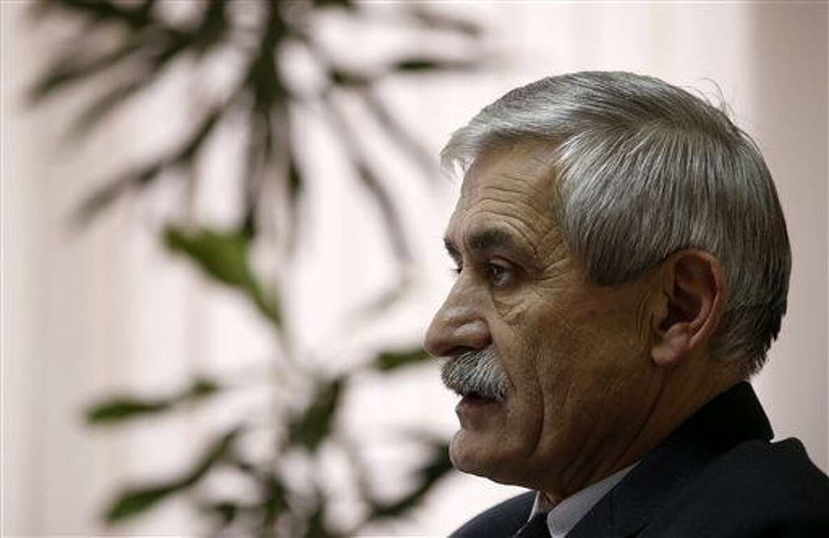 The head of a Serbian arms factory Milojko Brzakovic speaks during an interview with The Associated Press, in Belgrade, Serbia, Thursday, Dec. 10, 2015. Brzakovic of the Zastava arms factory told the Associated Press Thursday that the M92 semi-automatic pistol was traced after its serial number matched the one delivered to an American arms dealer in May 2013. (AP Photo/Darko Vojinovic)