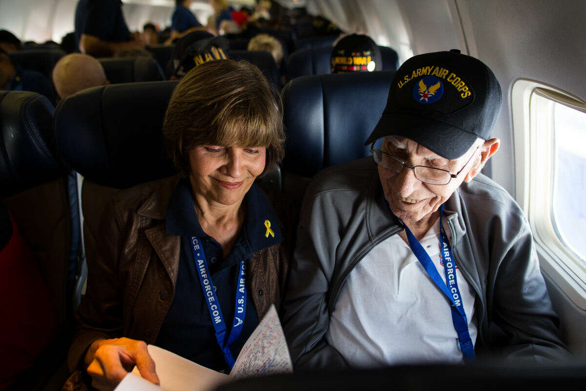 Debbie Siegmund reads a mail call letter to her father WWII U.S. Army Air Corps veteran J.O. Funderburk during the Permian Basin Honor Flight to Washington D.C. Courtney Sacco|Odessa American