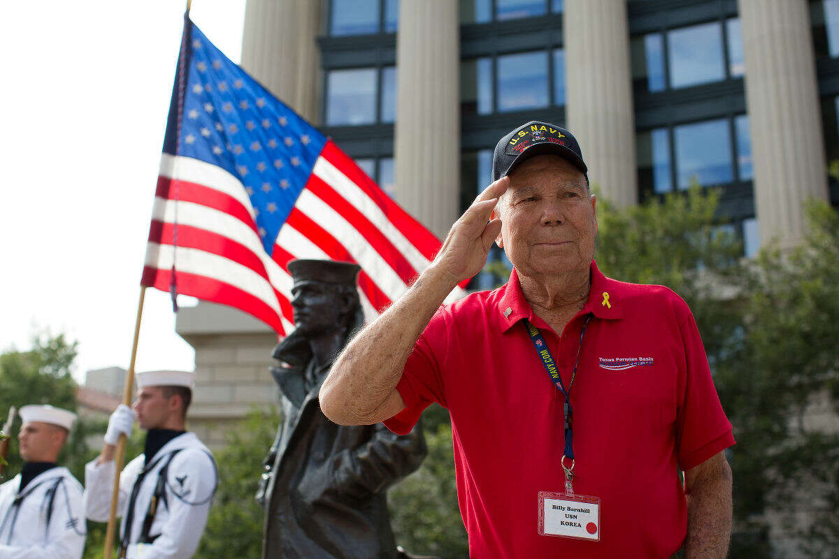 Billy Barnhill Korean war veteran salutes during a wreath laying ceremony Friday at the United States Navy Memorial in Washington D.C. Courtney Sacco|Odessa American
