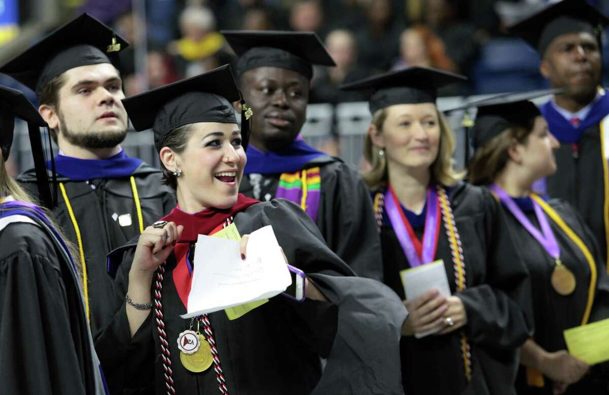 Janaina Bordignon, of Woodbridge, celebrates during the University of Bridgeport 's106th Commencement Ceremony at the Webster Bank Arena, in Bridgeport, Conn. on Saturday, May 7, 2016.