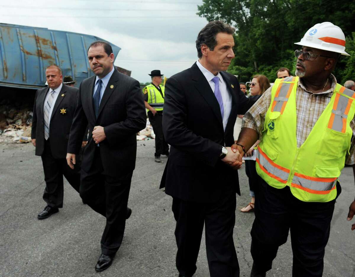 Gov. Andrew Cuomo, with Joe Percoco, center, visits the site of a train derailment on Thursday, June 27, 2013, in Mohawk, N.Y. (Cindy Schultz / Times Union archive)