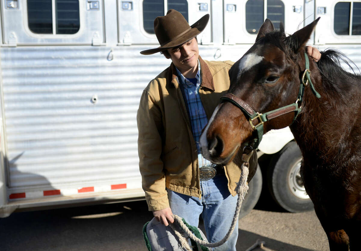 The Sandhills Quarter Horse Show will take place at the Horseshoe May 6 through 7. File photo: Daniel Dalager, a student at Midland College, pets his horse Lady after taking first place in the Open Ranch Horse competition during the Sandhills Quarter Horse Show on Saturday, Jan. 9, 2016, at Horseshoe Arena. James Durbin/Reporter-Telegram