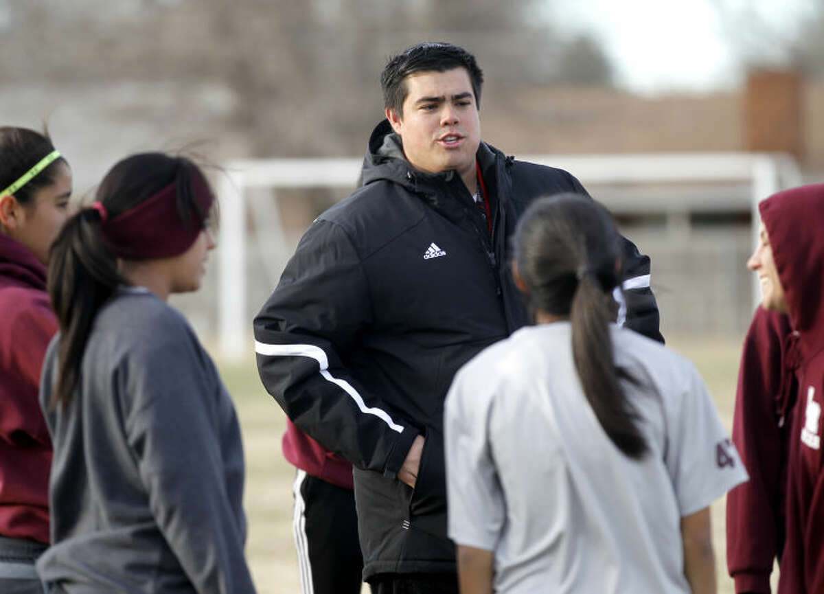 Lee girls soccer head coach Alan Castillejos talks to his team during practice during this 2014 file photo at Lee. James Durbin/Reporter-Telegram