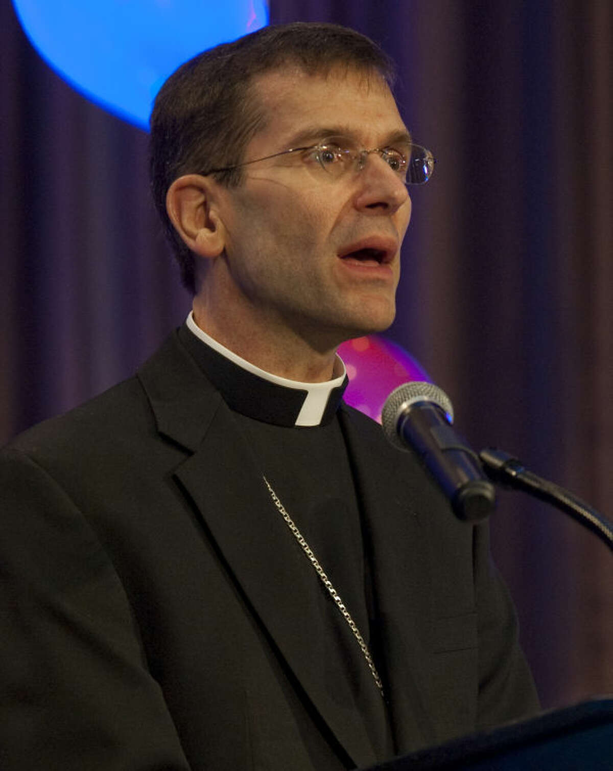 Bishop Michael Sis of San Angelo gives the invocation Wednesday at A Midland Prayer Breakfast.