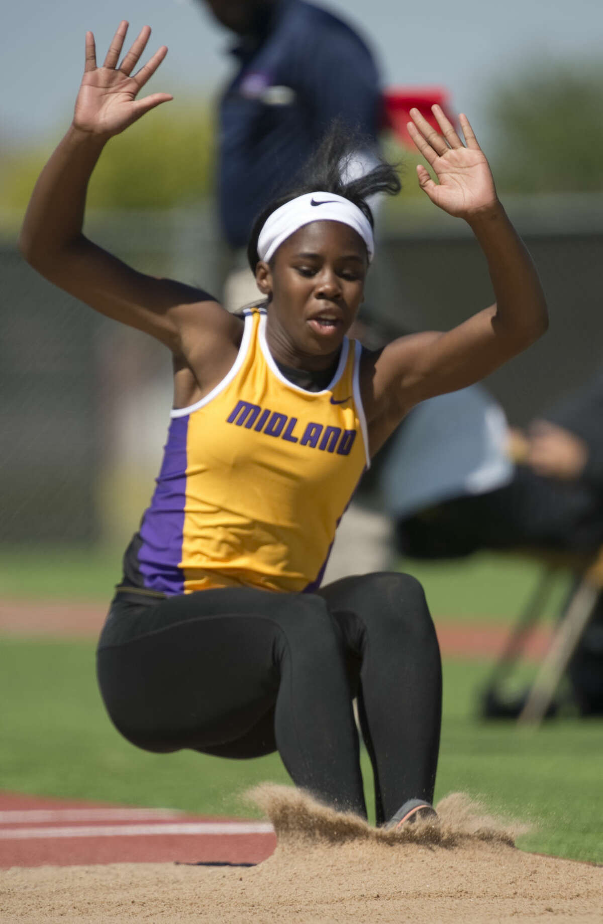 Midland High's Sametria Smith land in the pit on one of her triple jumps Thursday 04-14-16 in the District 3-6A Track and Field Championships at Ratliff Stadium. Tim Fischer\Reporter-Telegram