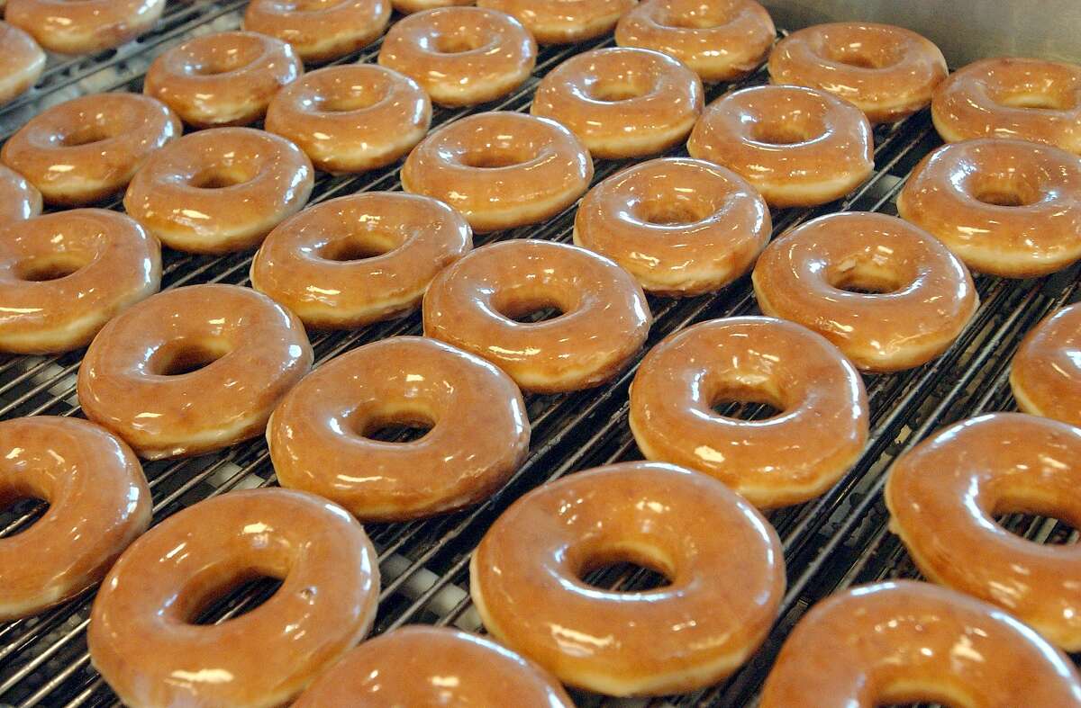 KRISPY KREME -- Freshly glazed donuts Tuesday September 24, 2002 for Tuesday, October 1 opening. (Robert McLeroy/Staff)