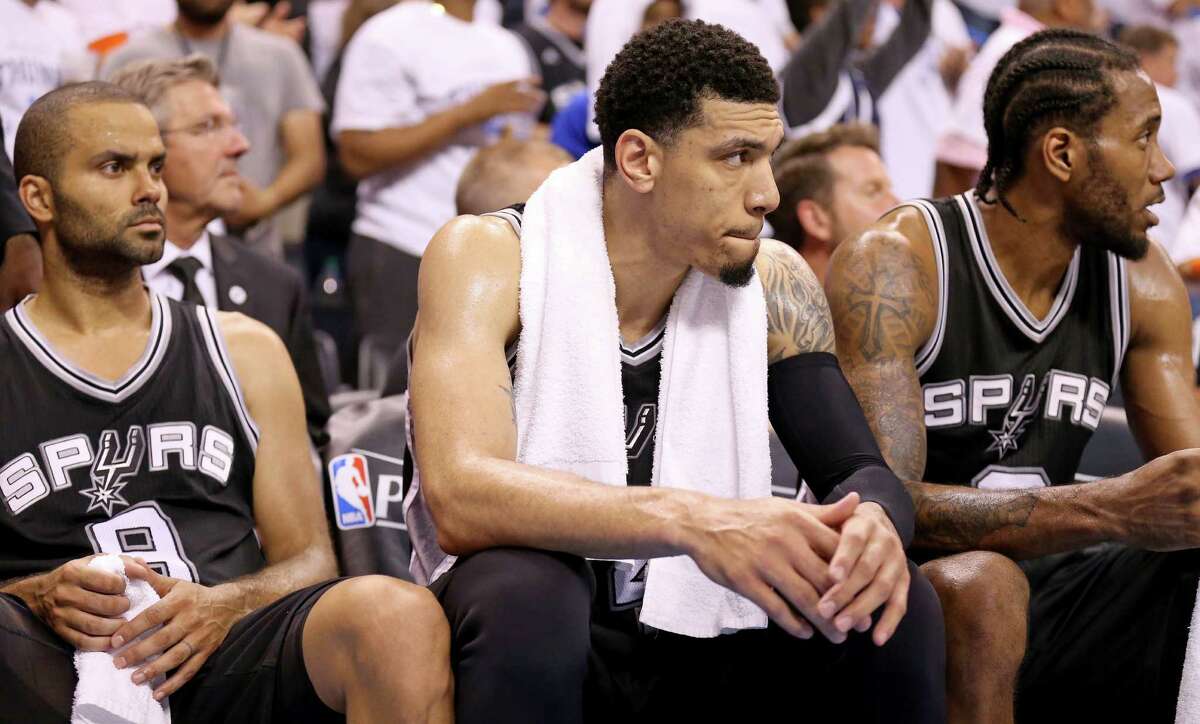 San Antonio Spurs' Tony Parker, Danny Green, and Kawhi Leonard sit dejected on the bench late in Game 4 in the Western Conference semifinals against the Oklahoma City Thunder Sunday May 8, 2016 at Chesapeake Energy Arena in Oklahoma City, Oklahoma. The Thunder won 111-97.
