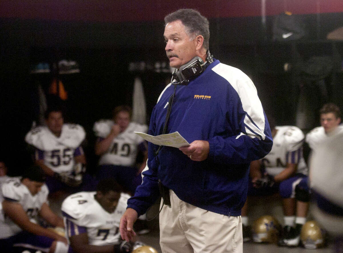 Midland High head football coach Craig Yenzer talks to his team before the start of the game against L.D. Bell on Friday at Pennington Stadium in Bedford. James Durbin/Reporter-Telegram