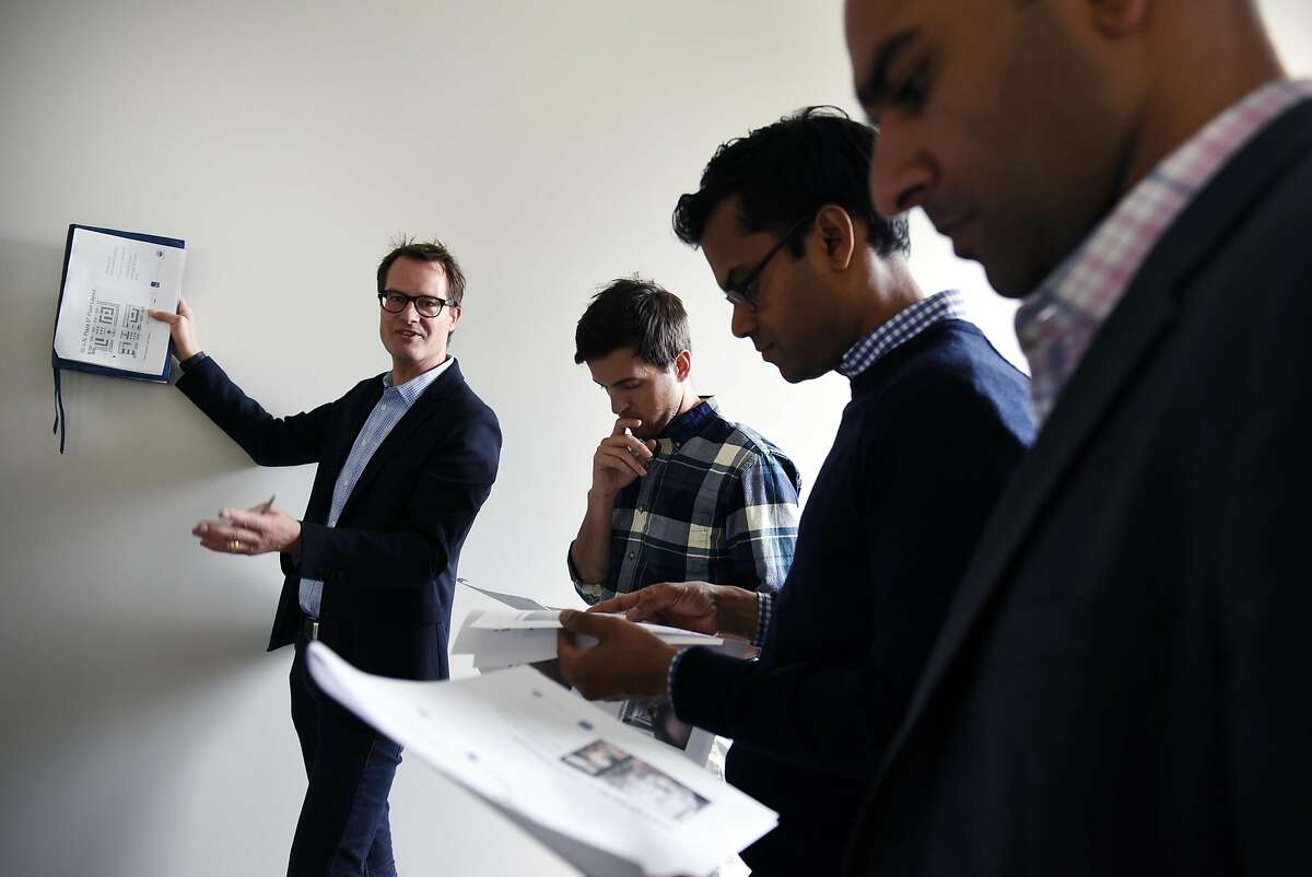 Gert Christen, left, of City Innovate, goes over layout plans with Andrew McMahon, Jay Nath, and Kamran Saddigue during a tour of the future home of the Superpublic innovation lab at 50 United Nations Plaza in San Francisco, CA, Friday, May 6, 2016. San Francisco and partners are building a 5,000 square foot innovation lab called Superpublic aimed at bringing together private industry, nonprofits and universities with federal, state and city government reps to tackle urban problems.