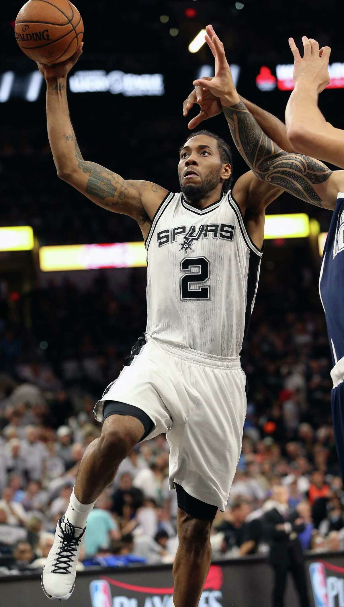 Kawhi Leonard goes in for a first quarter slam as the Spurs host the Thunder in game 1 of second round NBA playoff action at the AT&T Center on April 230, 2016.