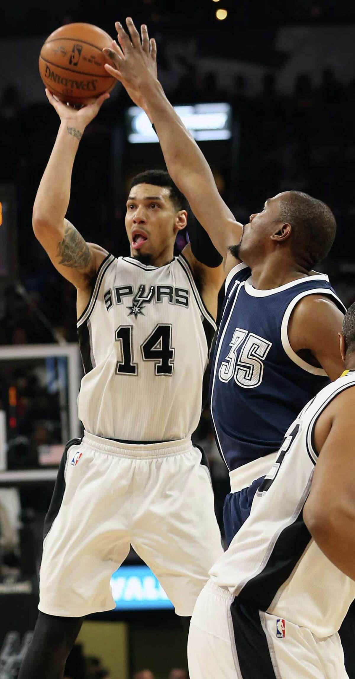 Danny Green pumps a three pointer and is fouled by Kevin Durant as the Spurs host the Thunder in game 1 of second round NBA playoff action at the AT&T Center on April 230, 2016.