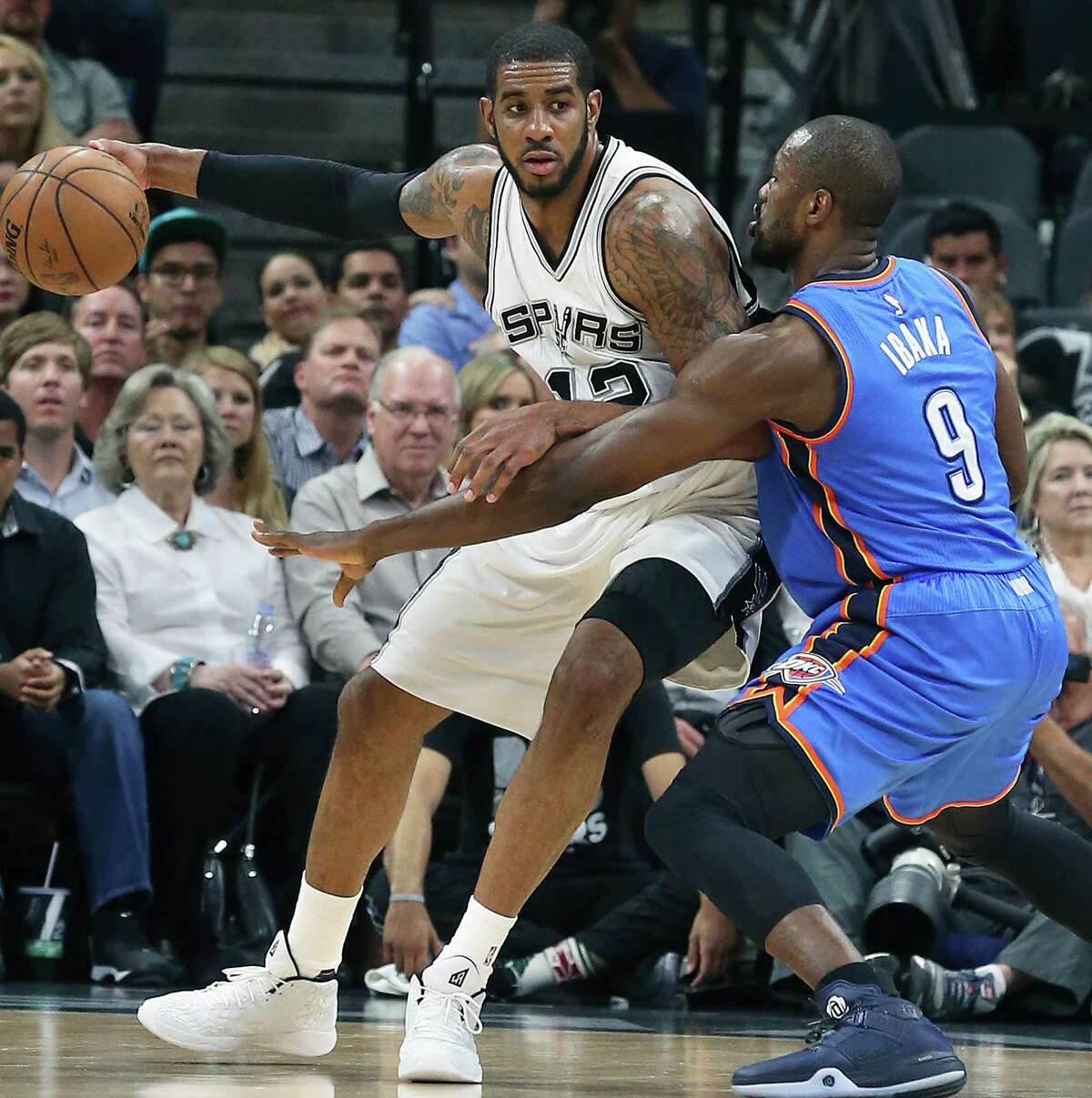 LaMarcus Aldridge pivots on Serge Ibaka as the Spurs host the Thunder in game 2 of second round NBA playoff action at the AT&T Center on May 2, 2016.