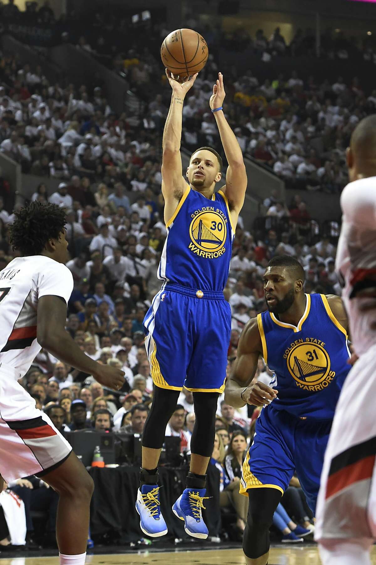 Stephen Curry #30 of the Golden State Warriors shoots the ball on Ed Davis #17 of the Portland Trail Blazers during the first quarter of Game Four of the Western Conference Semifinals during the 2016 NBA Playoffs at the Moda Center on May 9, 2016 in Portland, Oregon. NOTE TO USER: User expressly acknowledges and agrees that by downloading and/or using this photograph, user is consenting to the terms and conditions of the Getty Images License Agreement. (Photo by Steve Dykes/Getty Images)