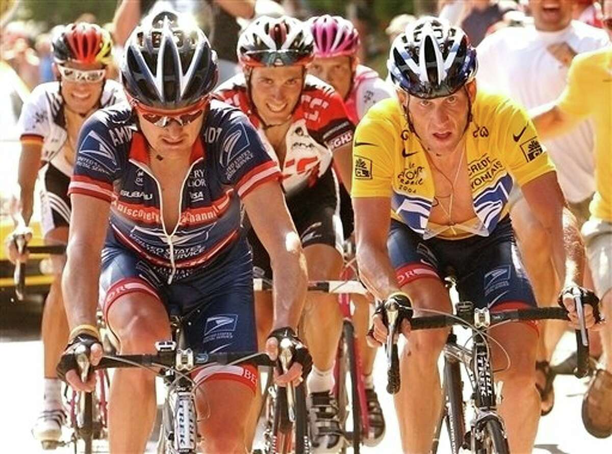 FILE - In this July 24, 2004, file photo, overall leader Lance Armstrong, right, of Austin, Texas, follows compatriot and teammate Floyd Landis, left, in the ascent of the La Croix Fry pass during the 17th stage of the Tour de France cycling race between Bourg-d'Oisans and Le Grand Bornand, French Alps. Armstrong, whose stirring victories after his comeback from cancer helped him transcend sports, chose not to pursue arbitration in the drug case brought against him by the U.S. Anti-Doping Agency. That was his last option in his bitter fight with USADA and his decision set the stage for the titles to be stripped and his name to be all but wiped from the record books of the sport he once ruled. (AP Photo/Bernard Papon, Pool, File)