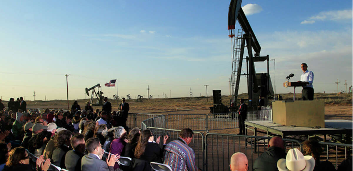 (File Photo) With oil pump jacks as a backdrop, President Barack Obama speaks at an oil and gas field on federal lands Wednesday, March 21, 2012, in Maljamar, N.M. The president is defending his energy agenda this week, traveling Wednesday to a solar panel plant in Nevada, but also the site of a future oil pipeline in Oklahoma.(AP Photo/Ross D. Franklin)