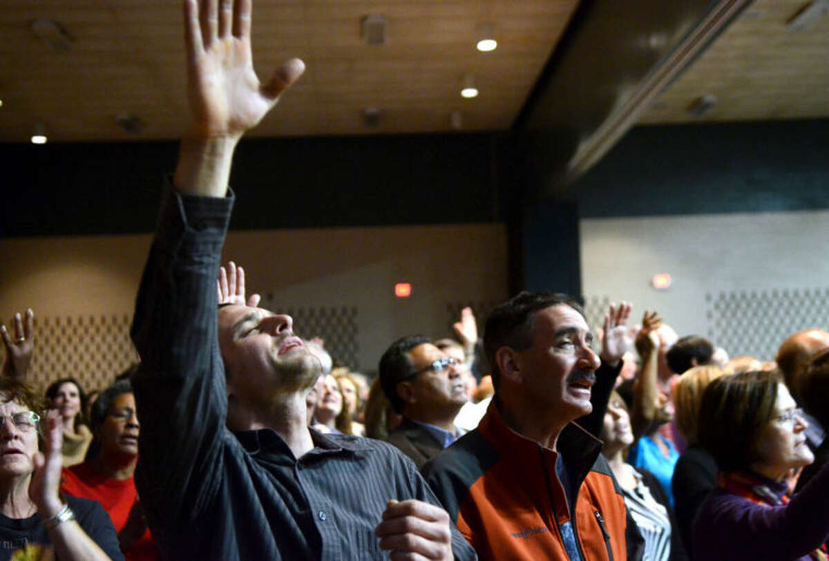 Attendees of the AWAKE 7:14 Prayer Revival worship Tuesday at the Midland Center. James Durbin/Reporter-Telegram
