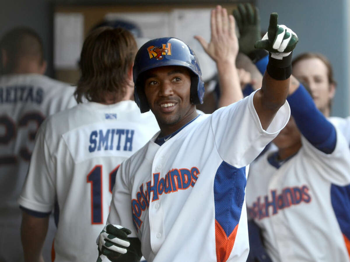 RockHounds' D'Arby Myers is congratulated by teammates after hitting a home run against Arkansas Travelers Saturday at Citibank Ballpark. James Durbin/Reporter-Telegram