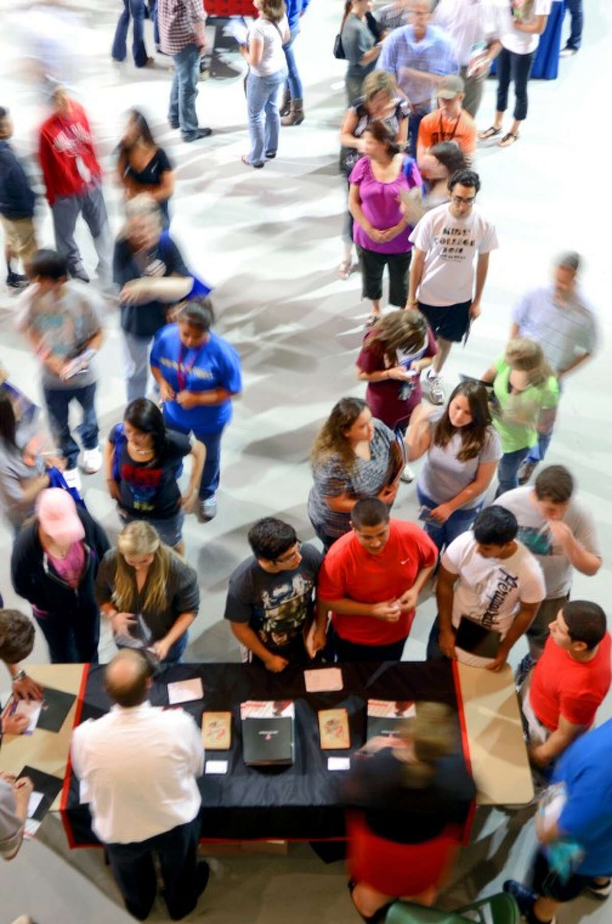 The Texas Tech table draws a large crowd during the College Forum Thursday at the Chaparrel Center. The free event gave students and families the opportunity to meet representatives from various area colleges. James Durbin/Reporter-Telegram