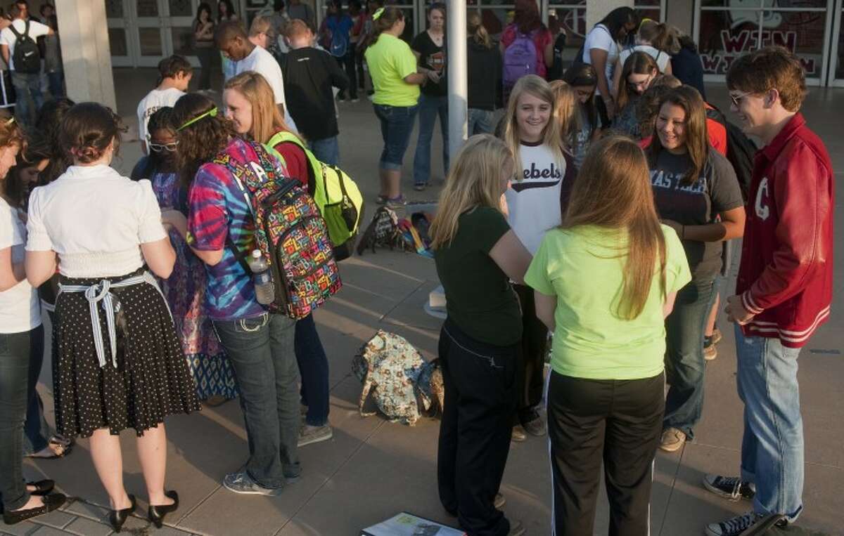 Students break into smaller prayer groups outside Lee High School Wednesday morning for the annual student led prayers for See You At the Pole. Tim Fischer\Reporter-Telegram