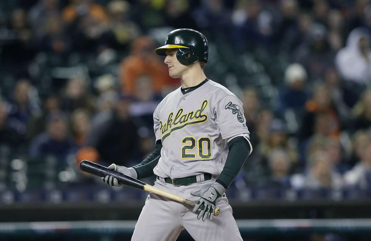 Oakland Athletics' Mark Canha pauses after striking out during the seventh inning of a baseball game against the Detroit Tigers, Wednesday, April 27, 2016, in Detroit. (AP Photo/Carlos Osorio)