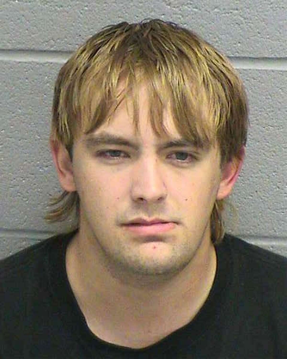Matthew Alexander Carroll, a convicted felon, as been arrested in connection with possessing firearms.