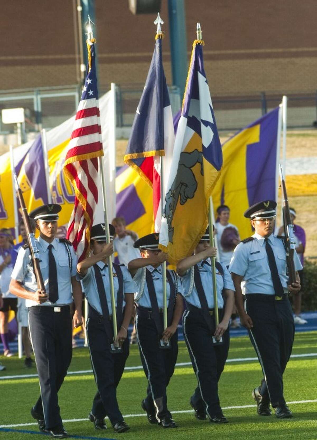 Members of Midland High Air Force JROTC present the colors Sept. 2 to start the Midland High vs. El Paso Del Valle football game at Grande Communications Stadium.