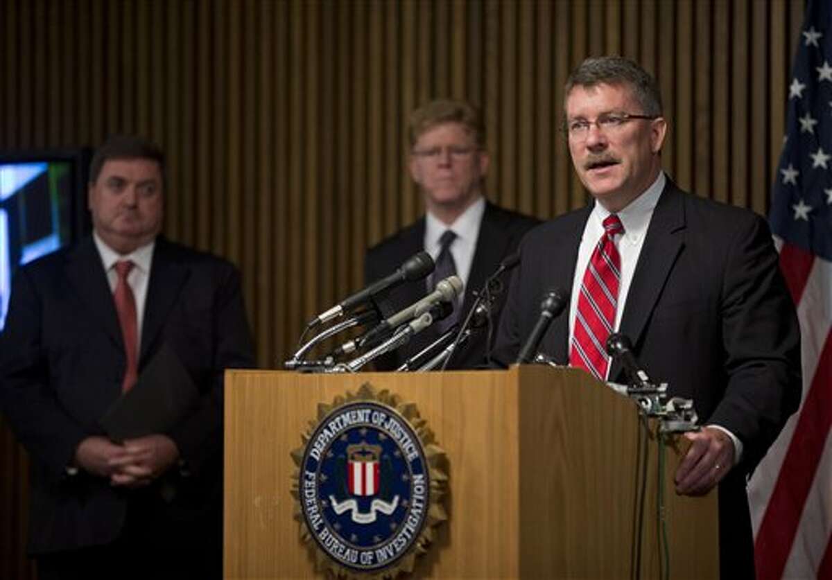 Ron Hosko, assistant director of the FBI's Criminal Investigative Division, right, speaks during a news conference at FBI headquarters in Washingotn, Monday, July 29, 2013, about "Operation Cross Country." The FBI says the operation rescued 105 children who were forced into prostitution in the United States and arrested 150 people it described as pimps and others in a series of raids in 76 American cities. From left are, John Ryan, CEO of National Center for Missing and Exploited Children, Drew Oosterbaan, chief of the DOJ Child Exploitation and Obscenity Section, and Hosko. (AP Photo/Evan Vucci)