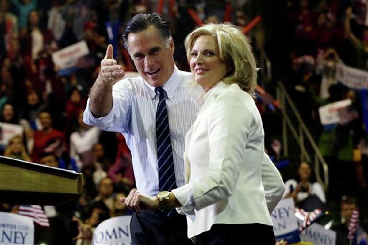 Republican presidential candidate and former Massachusetts Gov. Mitt Romney and wife Ann Romney stand on stage at a campaign rally at The Patriot Center at George Mason University in Fairfax, Va., Monday, Nov. 5, 2012. (AP Photo/Charles Dharapak)