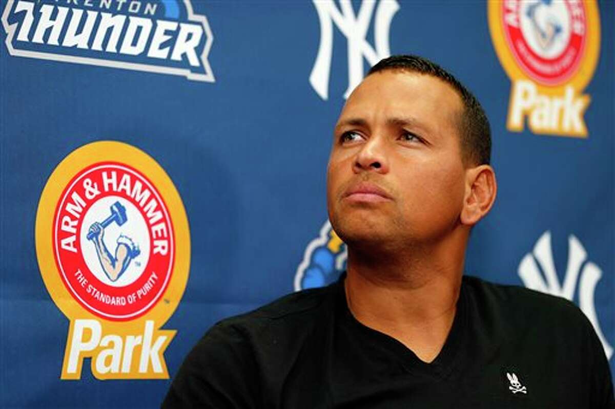 In this Aug. 3, 2013, photo, New York Yankees' Alex Rodriguez speaks to reporters during a news conference after a minor league baseball rehab start with the Trenton Thunder in a game against the Reading Fightin Phils, in Trenton, N.J. A person familiar with deliberations tells The Associated Press that Major League Baseball has informed the New York Yankees that Rodriguez will be suspended Monday, Aug. 5, 2013, but can play while he appeals the penalty. (AP Photo/Rich Schultz)