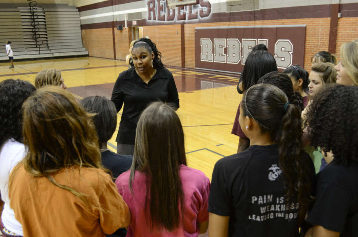 Monica Ramirez, new Lee head girls basketball coach, talks with players Thursday following a press conference to introduce her to Lee fans and supporters. Tim Fischer\Reporter-Telegram