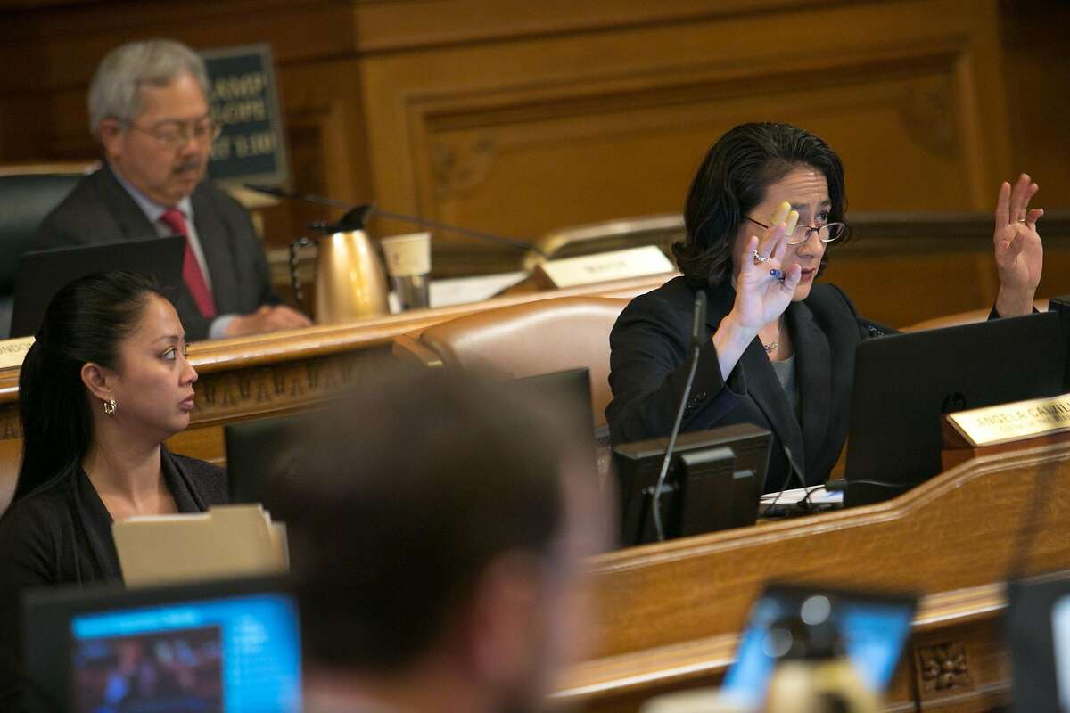 Angela Calvillo, clerk of the board, asks audience members to use their hands to show support or not instead of yelling out, during a Board of Supervisors meeting at City Hall on Tuesday, May 10, 2016 in San Francisco, Calif.