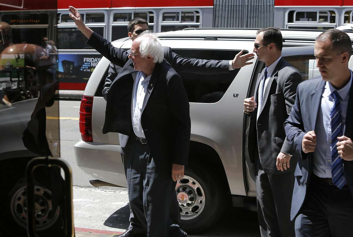 Democratic presidential candidate Senator Bernie Sanders waves to supporters as he arrives at the San Francisco Chronicle on Tues. May 10, 2016 in San Francisco California, for a meeting with the editorial board.