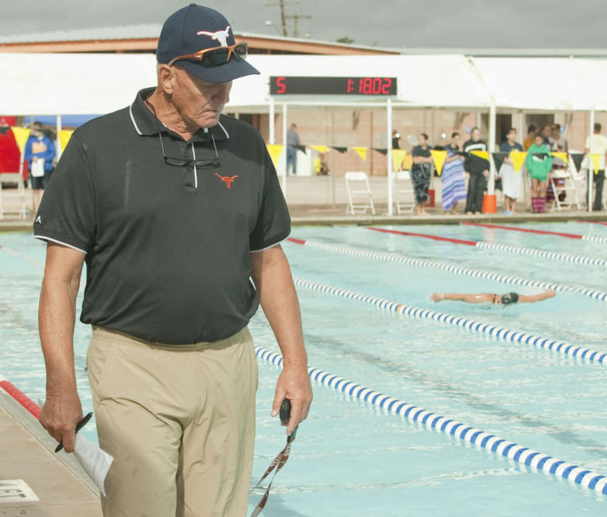 Former Olympian and Midlander, Doug Russell, coaches his swimmers with Longhorn Aquatics Team Friday during the Western National Bank Invitational at his namesake, Doug Russell Pool. Tim Fischer\Reporter-Telegram