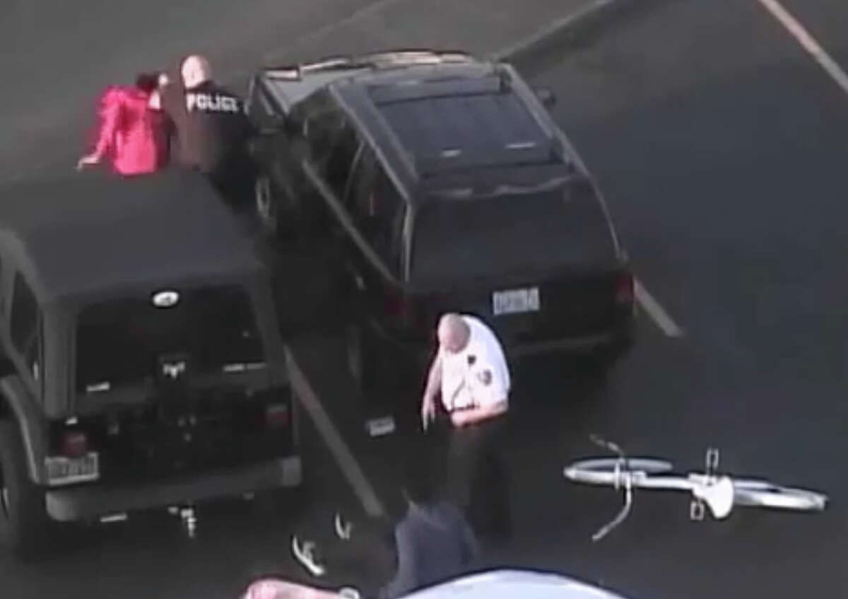 This still image taken from a security video shows the May 2014 arrest of a 15-year-old girl at Tacoma Mall. The girl has sued the mall, the security firm and the off-duty police officer who arrested her.